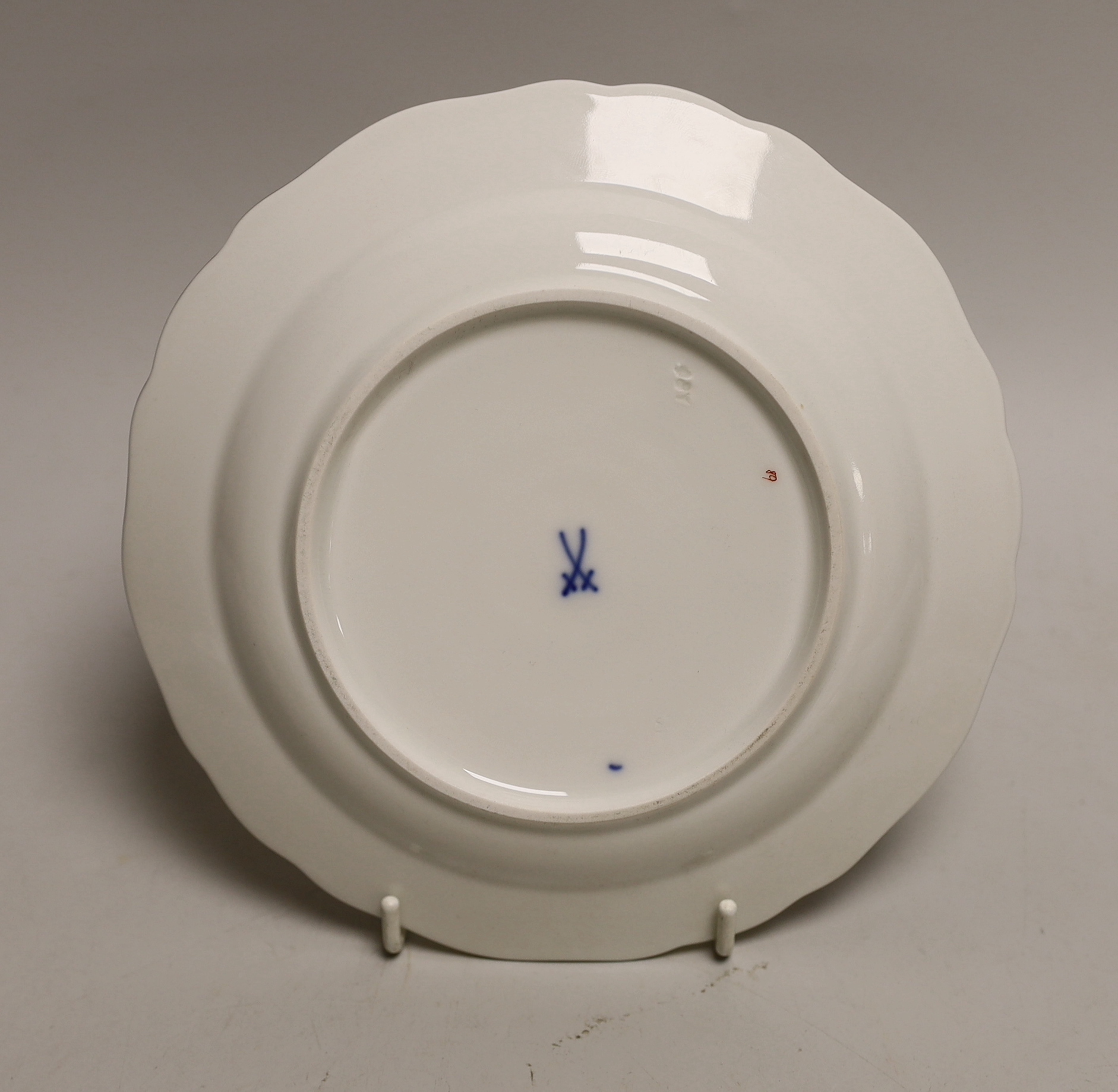 Four Meissen porcelain items including a plate, two small outside decorated dishes and a miniature lidded pot, plate 18cm